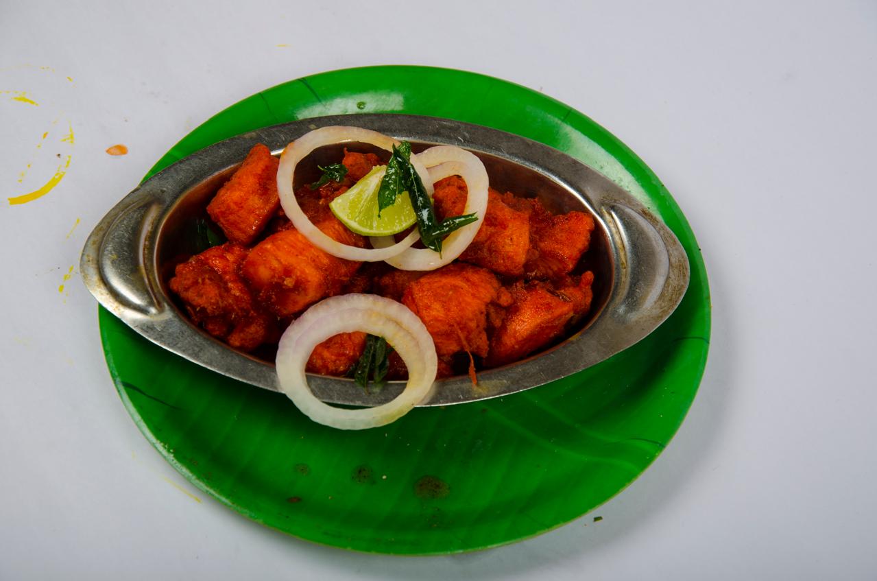 Happy guest dining at KARNA Multicuisine Restaurant, Bodinayakanur